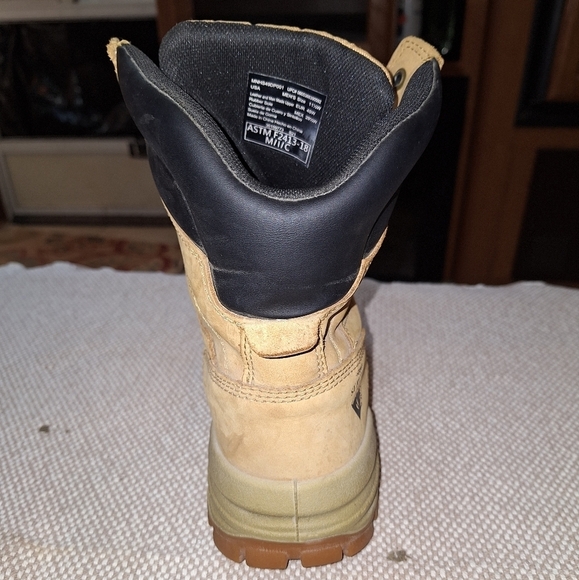 A pair of Herman Survivors leather boots in a men's size 11.5 Wide. Safety Toe. - Picture 10 of 12